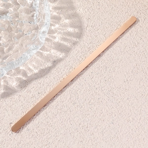 Detailed view of polished rose gold stainless steel bar for custom engraving on C-shape bracelet