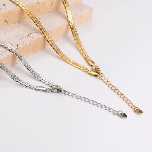 Minimalist square pearl chain necklace set in gold and silver finish on stone background