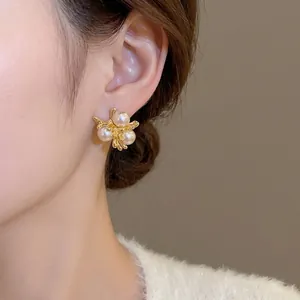 French vintage gold branch stud earrings featuring three elegant cream pearls