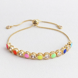 Adjustable gold rainbow bracelet with colorful enamel dots and sparkling cubic zirconia