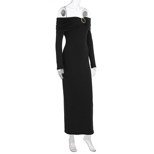 Detail of black off-shoulder maxi dress with golden ring buckle and knit texture