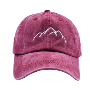 Deep red washed cotton baseball cap featuring minimalist white mountain embroidery on front
