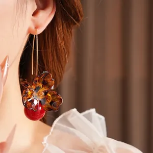 Vintage floral leopard print drop earrings with amber resin and dark red beads