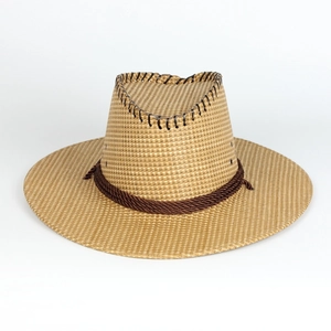 Detail of western straw cowboy hat showing texture, leather stitching and twisted rope band