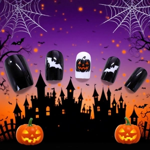 Halloween press-on nails with black bat and pumpkin patterns on a purple background