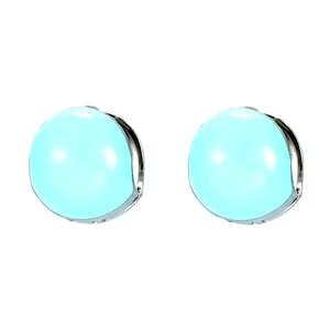 Detail of light blue jelly heart earrings with silver metal base on white background
