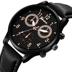 Macro view of men's quartz watch showing black dial, gold markers and leather stitching