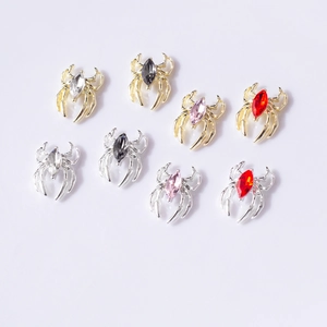 Halloween spider nail art charms with marquise rhinestones in gold and silver finishes