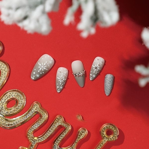 Christmas press on nails set with snowflake designs, rhinestones and silver glitter