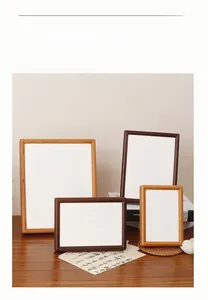 Detail of premium walnut and oak wood picture frames with elegant white matting inserts