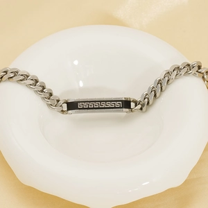 Men's stainless steel chain bracelet featuring Greek key pattern on a curved metal plate