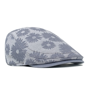 Detail of grey daisy jacquard denim ivy cap with floral texture and neat stitching