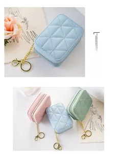 Quilted mini lipstick pouches with gold zippers and keychains in pastel colors