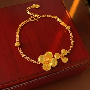 Vintage gold plated double chain bracelet with matte textured flower pendants