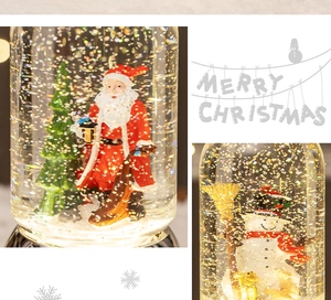 Detail of Christmas lantern snow globe with Santa and glitter sparkles inside