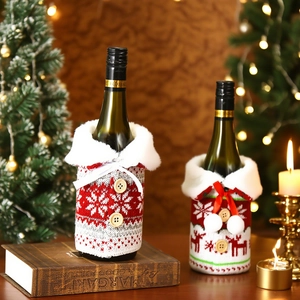 Festive knitted Christmas wine bottle covers with faux fur collars and button details