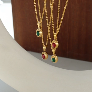 Golden Egyptian Pharaoh necklaces with red and green gemstone pendants and O-chains