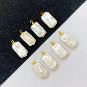 Set of eight white natural freshwater baroque pearl rectangular pendants with gold loops