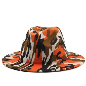 Detail of wool fedora hat featuring bold orange and brown camo print on a flat brim