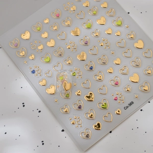 Stickers à ongles 3D cœurs métalliques avec motifs 5D embossés argent et or colorés