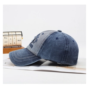 Detail of vintage washed denim baseball cap featuring high-quality WARD letter embroidery