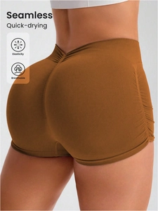Detail showing seamless brown fitness shorts with scrunch butt lifting texture and icons