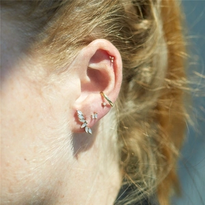 Detail of S925 silver gold ear climber set featuring marquise opal and sparkling stars
