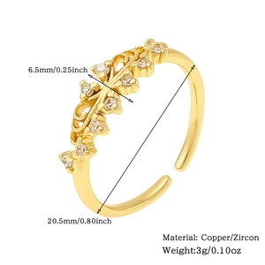 Detail view of gold leaf ring with zircon stones, material specs, and size measurements