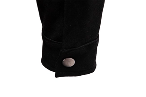 Detail of black faux suede jacket cuff featuring a classic metal button and fine stitching