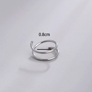 Detailed macro view showing the 0.8cm inner diameter of a silver double spiral nose ring