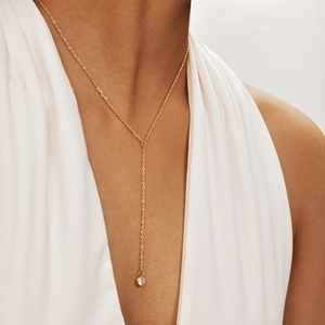 Elegant 18K gold stainless steel Y-shaped necklace with round zircon pendant on a model