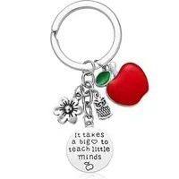 Detail view of steel teacher appreciation keychain with red apple and engraved heart charm