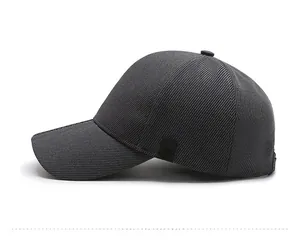 Side view of dark gray baseball cap showing breathable textured fabric and structured panels