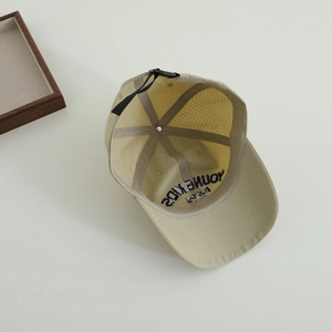 Internal view of mesh lining and adjustable strap on child sun hat with embroidery