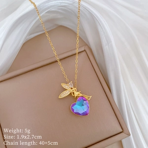 Detail of angel heart pendant with weight and size specs on elegant brown jewelry box