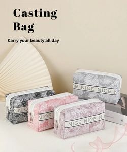 Close-up of floral pattern fabric and NICE letter ribbon on waterproof makeup bag