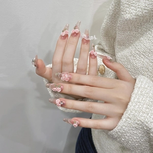Elegant long trapezoid press-on nails with 3D pink roses, pearls, and lace detail