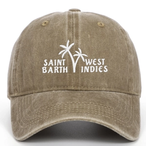 Detail of white palm tree embroidery on a vintage washed khaki cotton baseball cap