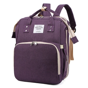 Macro view of purple diaper bag with large opening and durable textured fabric details