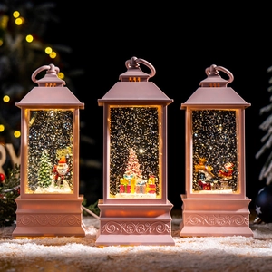 Pink vintage Christmas music snow globe lantern with festive scene for holiday home decor.
