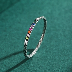 Vintage S925 silver ring with colorful gemstones and honeycomb texture on dark green fabric