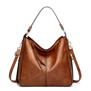 Brown vintage PU leather tote bag with gold hardware and adjustable crossbody strap