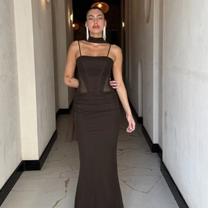 Close-up of dark brown bodycon evening dress with side ruching and delicate mesh detail