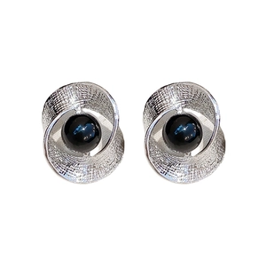 Silver twisted mesh earrings with black round gems shown in a pair on white background