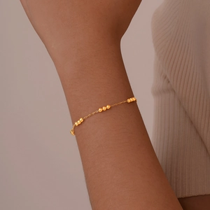 Elegant gold beaded chain bracelet for women in a minimalist stainless steel style