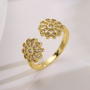 Gold open ring with double daisy flowers and shimmering cubic zirconia stones