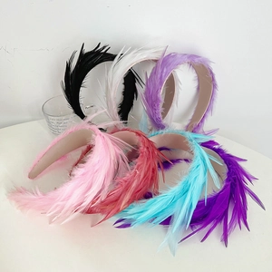 Colorful feather headbands for women in multiple vibrant shades on a white surface