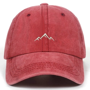Vintage washed red cotton baseball cap featuring minimalist mountain embroidery