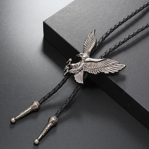 Western style vintage bolo tie with silver eagle pendant on black braided leather cord