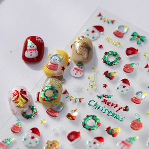 3D gold embossed Christmas nail art stickers with Santa, snowman and snowflake designs